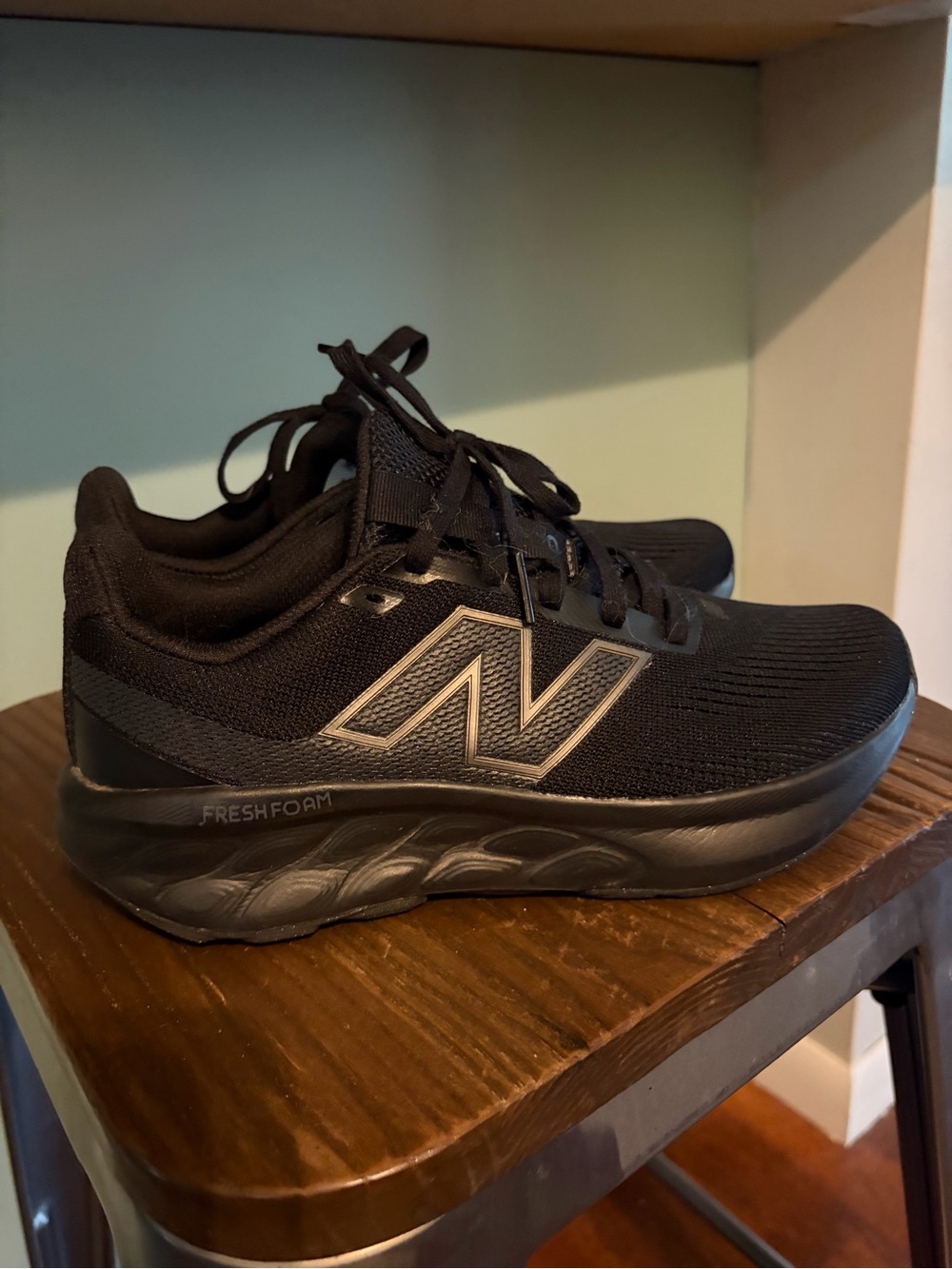 New Balance women’s Black Athletic Running Sneakers with Silver Logo